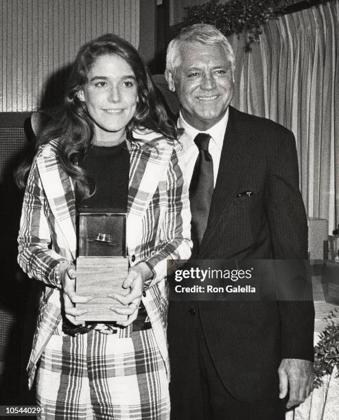 Actress receiving an award from Cary Grant during 3rd Annual Straw Hat Awards at Tavern on the Green in New York City, New York, United States.