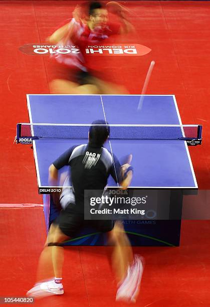 Zi Yang of Singapore and Ning Gao of Singapore compete in the Men's Singles Gold Medal Match at Yamuna Sports Complex during day eleven of the Delhi...