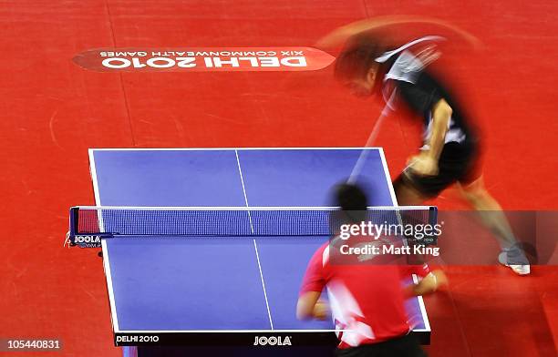 Ning Gao of Singapore and Zi Yang of Singapore compete in the Men's Singles Gold Medal Match at Yamuna Sports Complex during day eleven of the Delhi...