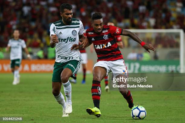 Vitinho of Flamengo struggles for the ball with Thiago Santos of Palmeiras during a match between Flamengo and Palmeiras as part of Brasileirao...