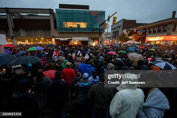 People gather for a interfaith candlelight vigil a few blocks away from the site of a mass shooting at the Tree of Life Synagogue on October 27, 2018...