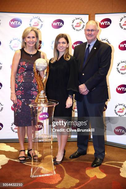 Simona Halep of Romania poses with WTA President Micky Lawler and CEO and Chairman Steve Simon after winning the Chris Evert WTA World No.1...