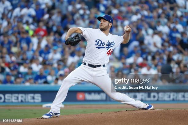 Pitcher Rich Hill of the Los Angeles Dodgers pitches in the first inning during Game Four of the 2018 World Series against the Boston Red Sox at...