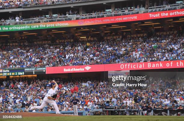 Pitcher Rich Hill of the Los Angeles Dodgers throws out the first pitch in the first inning during Game Four of the 2018 World Series against the...