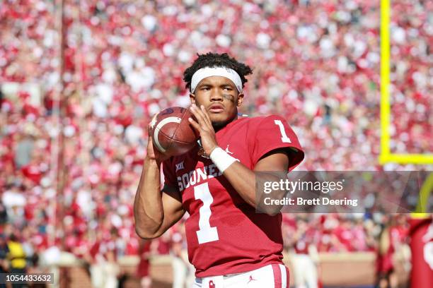 Quarterback Kyler Murray of the Oklahoma Sooners warms up on the sidelines during the game against the Kansas State Wildcats at Gaylord Family...