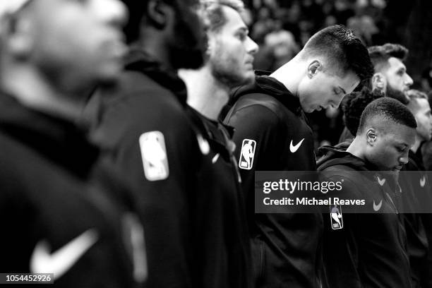 Damian Lillard of the Portland Trail Blazers observes the national anthem prior to the game against the Miami Heat at American Airlines Arena on...