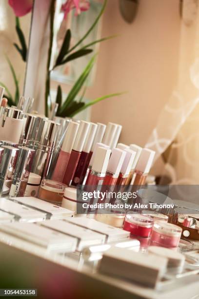 table with cosmetics products - makeup table stock pictures, royalty-free photos & images