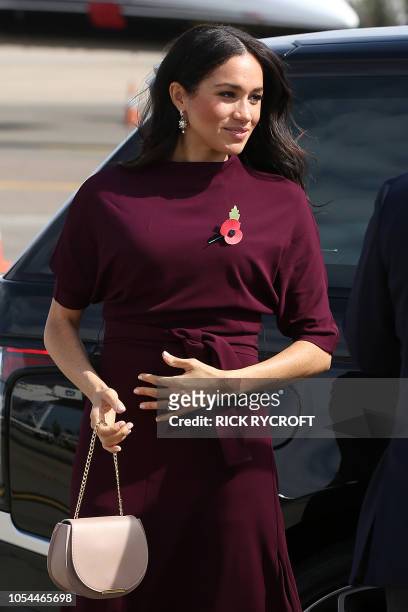 Britain's Meghan, Duchess of Sussex prepares to depart with Prince Harry for New Zealand from Sydney airport on October 28, 2018. - Prince Harry and...