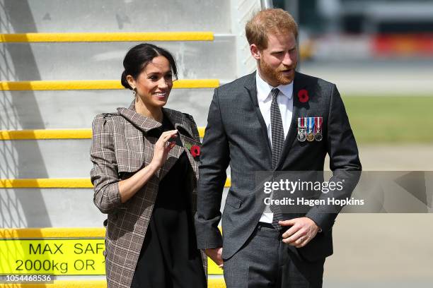 Prince Harry, Duke of Sussex and Meghan, Duchess of Sussex arrive at the Wellington International Airport Military Terminal on October 28, 2018 in...