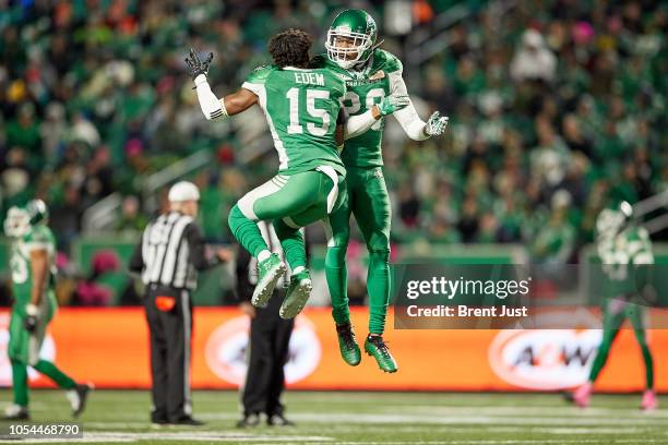 Mike Edem and Loucheiz Purifoy of the Saskatchewan Roughriders celebrate after a turnover in the game between the BC Lions and Saskatchewan...