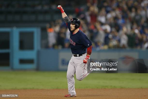 Steve Pearce of the Boston Red Sox rounds the bases after hitting a solo home run in the eighth inning during Game 3 of the 2018 World Series against...