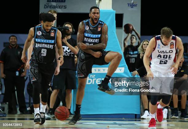 Shawn Long of the NZ Breakers celebrates with Corey Webster as they take the lead during the round three NBL match between the New Zealand Breakers...