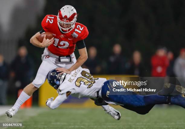 Davis Shanley of the Western Kentucky Hilltoppers is tackled on the run by Richard Dames of the Fiu Golden Panthers on October 27, 2018 in Bowling...