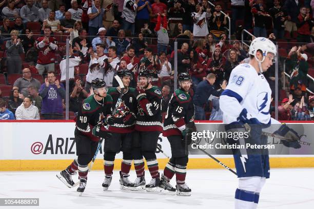 Michael Grabner, Niklas Hjalmarsson, Kevin Connauton and Brad Richardson of the Arizona Coyotes celebrate after Grabner scored a shorthanded goal...