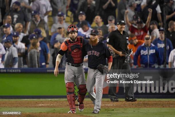 Catcher Blake Swihart and pitcher Craig Kimbrel of the Boston Red Sox congratulate one another after defeating the Los Angeles Dodgers 9-6 in Game...