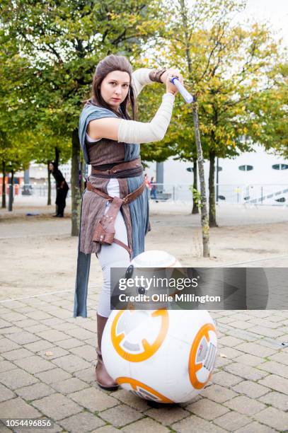 Cosplayer in character as Rey from Star Wars with a remote control BB8 seen during Day 2 of MCM London Comic Con 2018 at ExCel on October 27, 2018 in...