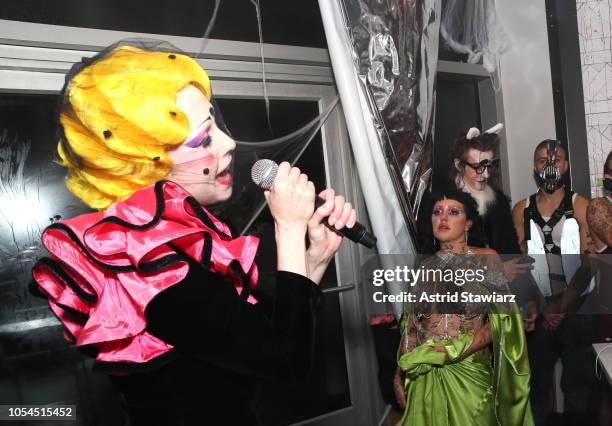 Allie X performs as Brooke Candy looks on at The Misshapes Halloween party hosted by Ketel One Family-Made Vodka on October 27, 2018 in New York City.