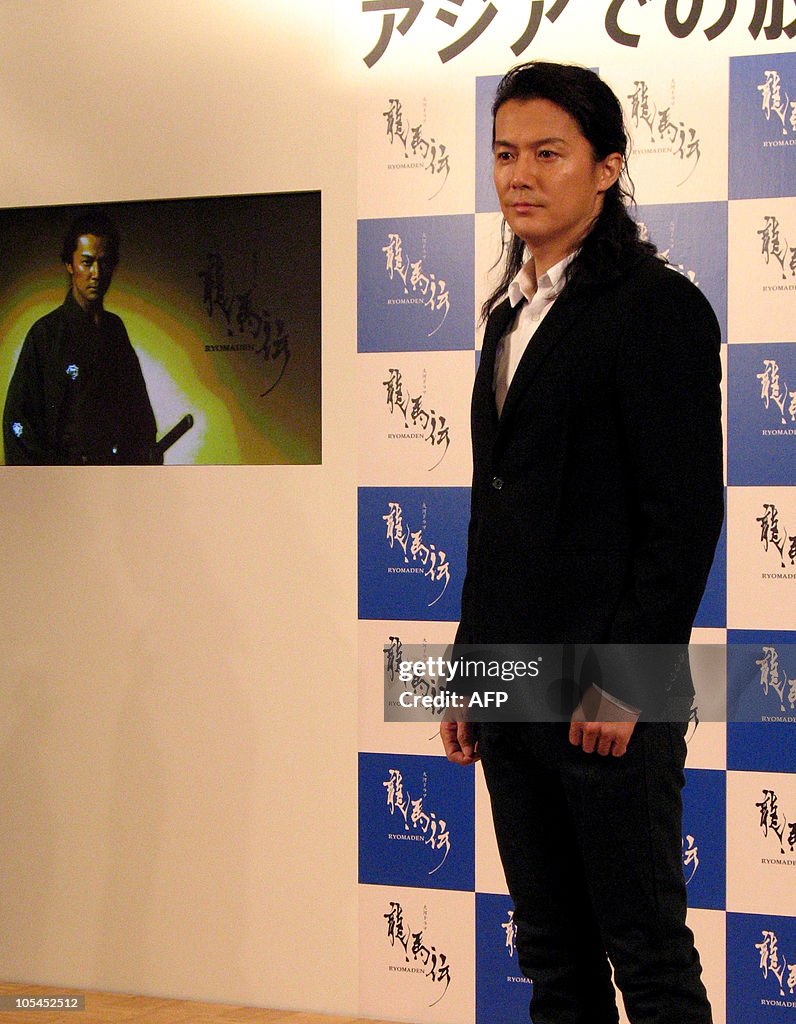 Japanese actor Masaharu Fukuyama poses a