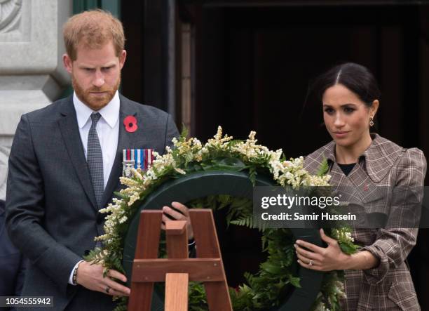 Prince Harry, Duke of Sussex and Meghan, Duchess of Sussex lay a wreath as they visit the National War Memorial on October 28, 2018 in Wellington,...
