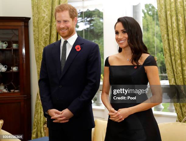 Prince Harry, Duke of Sussex and Meghan, Duchess of Sussex wait to meet New Zealand Prime Minister Jacinda Ardern, at Government House on October 28,...