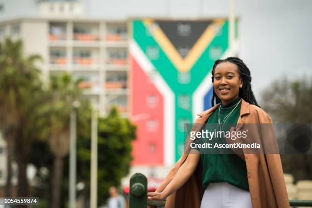 confident south african woman - south african flag stock pictures, royalty-free photos & images