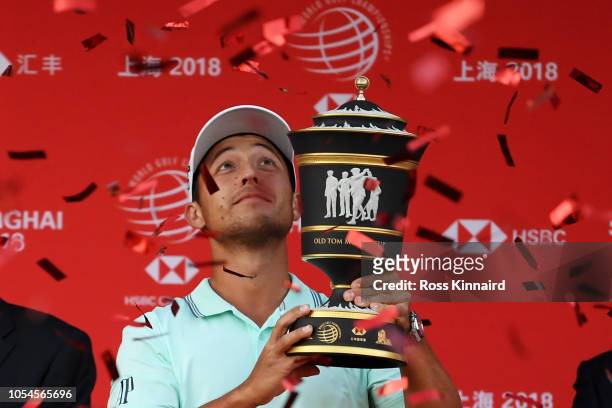 Xander Schauffele of the United States celebrates with the winner's trophy after the final round of the WGC - HSBC Champions at Sheshan International...