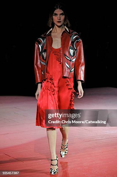 Model walks the runway at the Miu Miu fashion show during Paris Fashion Week on October 6, 2010 in Paris City.