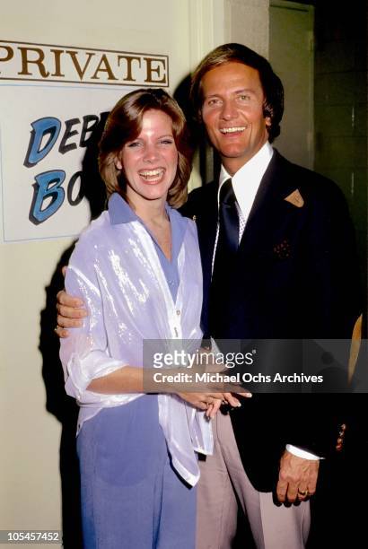 Singer Debby Boone poses with her father singer Pat Boone outside her dressing room during rehearsals for her televised concert at KHJ Studios on...