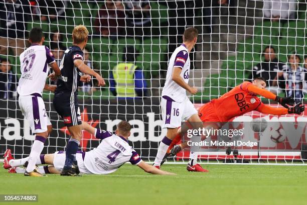 Glory goalkeeper Liam Reddy saves a kick for goal by Keisuke Honda of the Victory during the round two A-League match between the Melbourne Victory...