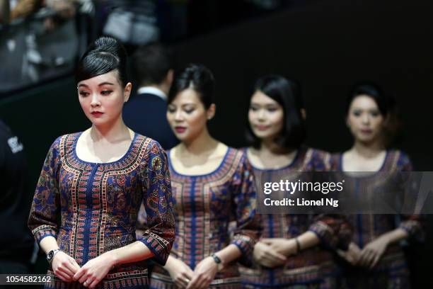 Singapore Airlines girls during the Women's Doubles prize ceremony on day 8 of the 2018 BNP Paribas WTA Finals Singapore presented by SC Global at...