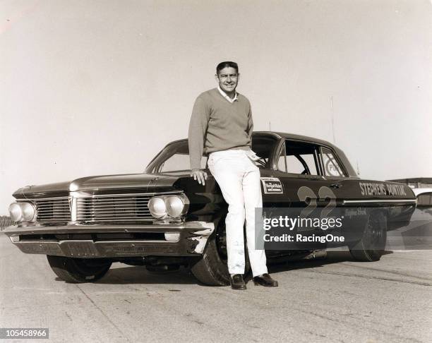 Fireball Roberts poses with Smokey YunickÕs factory Pontiac at Daytona International Speedway. Roberts would go on to win the Daytona 500 NASCAR Cup...