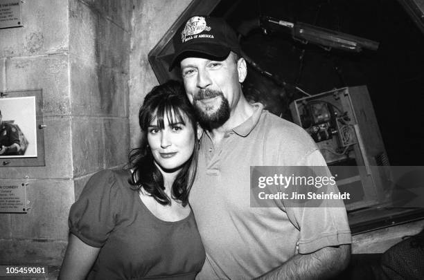Demi Moore and Bruce Willis pose for a portrait at the opening of Planet Hollywood at the Mall of America in Bloomington, Minnesota on December 12,...