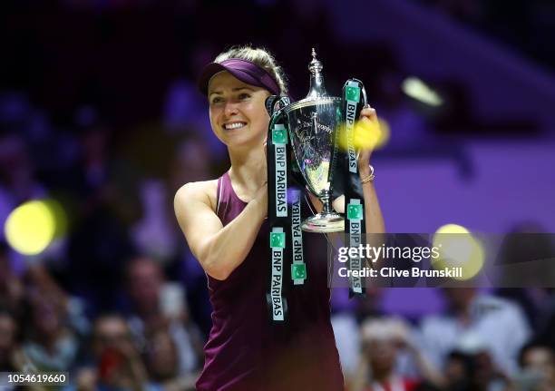 Elina Svitolina of the Ukraine poses with the Billie Jean King Trophy after her win against Sloane Stephens of the United States during the Women's...