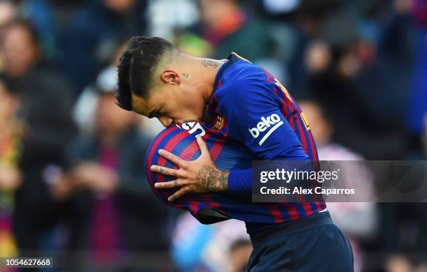 Philippe Coutinho of Barcelona celebrates scoring his sides first goal during the La Liga match between FC Barcelona and Real Madrid CF at Camp Nou...