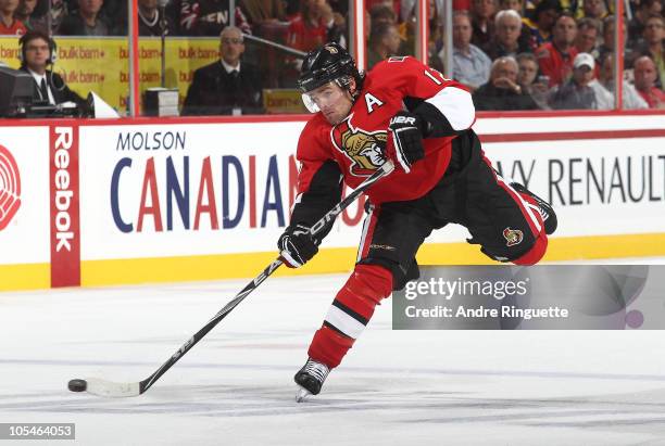 Mike Fisher of the Ottawa Senators shoots the puck, scoring a first period goal against the Carolina Hurricanes at Scotiabank Place on October 14,...