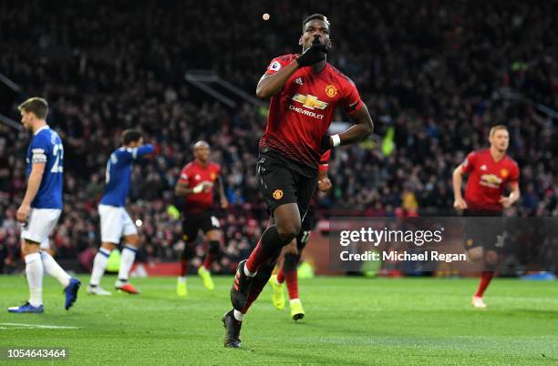 Paul Pogba of Manchester United celebrates after scoring his team's first goal during the Premier League match between Manchester United and Everton...