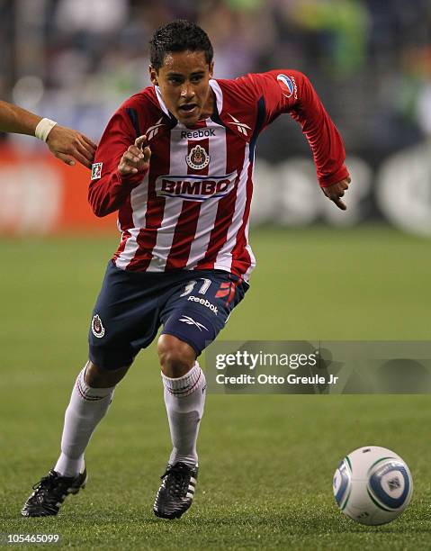 Mitchel Oviedo of Chivas de Guadalajara dribbles against the Seattle Sounders FC on October 12, 2010 at Qwest Field in Seattle, Washington.