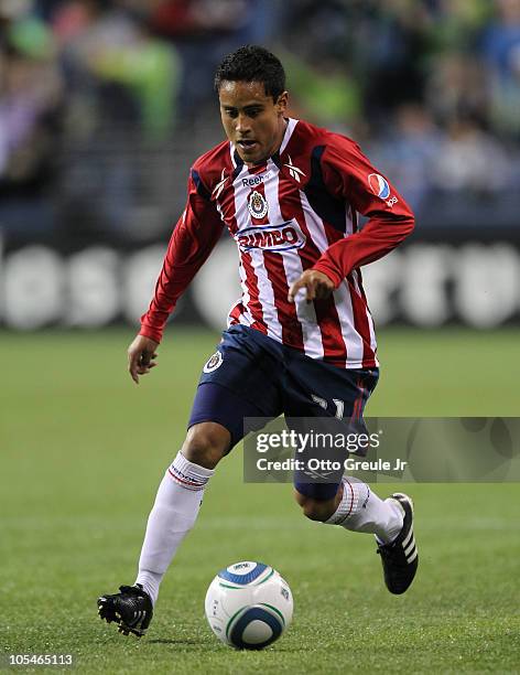 Mitchel Oviedo of Chivas de Guadalajara dribbles against the Seattle Sounders FC on October 12, 2010 at Qwest Field in Seattle, Washington.