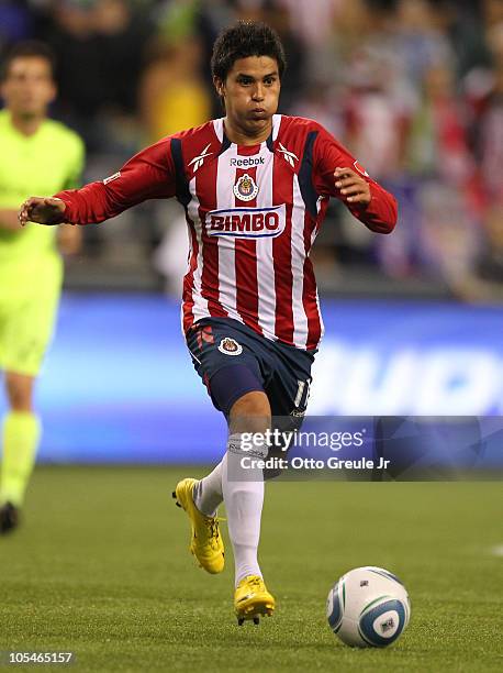 Ulises Davila of Chivas de Guadalajara dribbles against the Seattle Sounders FC on October 12, 2010 at Qwest Field in Seattle, Washington.