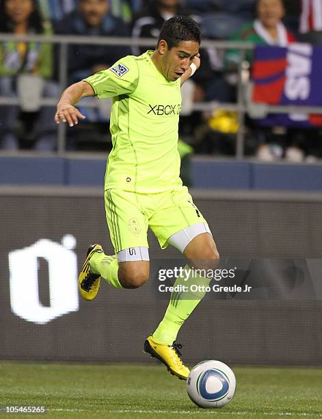 David Estrada of the Seattle Sounders FC dribbles against Chivas de Guadalajara on October 12, 2010 at Qwest Field in Seattle, Washington.