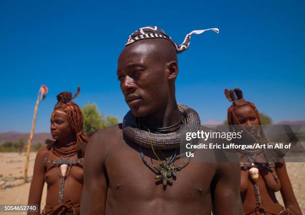 Himba tribe men and women, Cunene Province, Oncocua, Angola on August 13, 2010 in Oncocua, Angola.