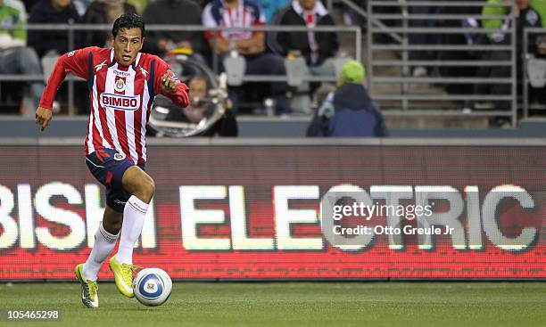 Omar Esparza of Chivas de Guadalajara dribbles against the Seattle Sounders FC on October 12, 2010 at Qwest Field in Seattle, Washington.