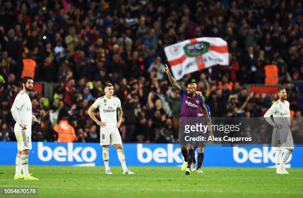Arturo Vidal of Barcelona celebrates scoring his sides fifth goal as Real Madrid players look dejected during the La Liga match between FC Barcelona...