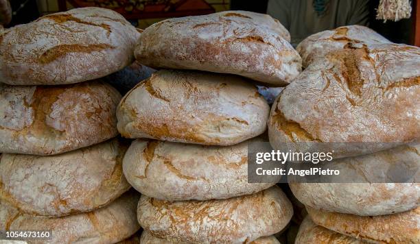 mediterranean food - some pieces of tradictioal bread - round loaf stock pictures, royalty-free photos & images