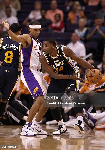Miles of the Utah Jazz handles the ball during the preseason NBA game against the Phoenix Suns at US Airways Center on October 12, 2010 in Phoenix,...
