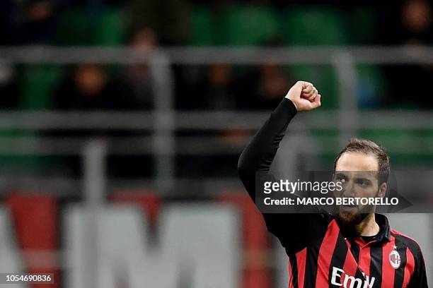 Milan's Argentinian forward Gonzalo Higuain celebrates after scoring during the Italian Serie A football match AC Milan vs Sampdoria at the 'Giuseppe...