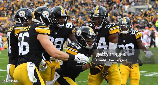 Joe Haden of the Pittsburgh Steelers reacts with teammates after a interception during the first half in the game against the Cleveland Browns at...