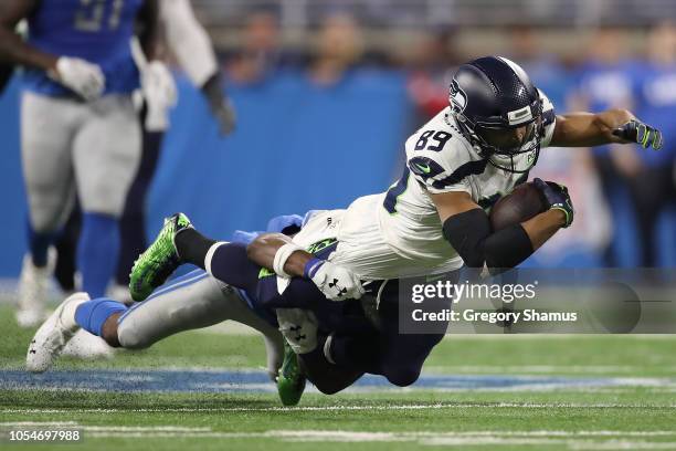 Nevin Lawson of the Detroit Lions makes a tackle on Doug Baldwin of the Seattle Seahawks during the first half at Ford Field on October 28, 2018 in...