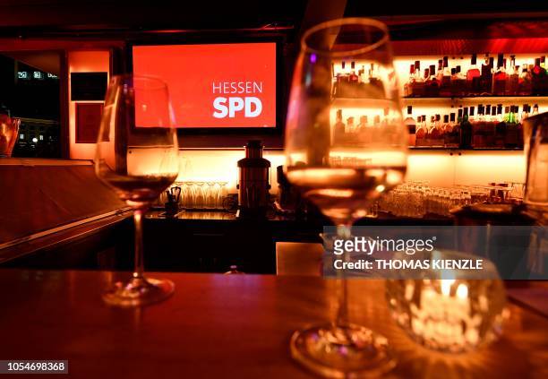 Empty glasses are pictured in the restaurant near the State Parliament of Hesse where supporters of Germany's Social Democratic Party reacted after...