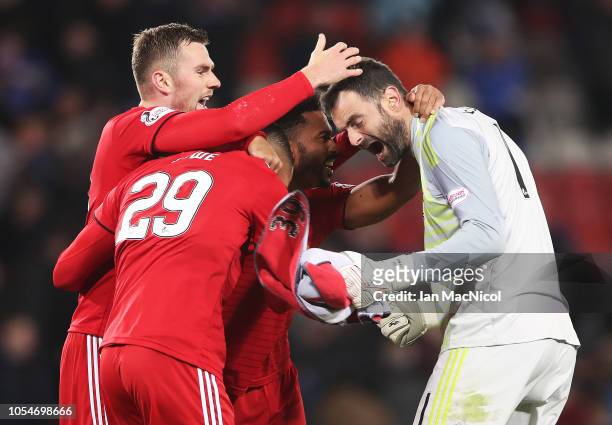 Joe Lewis, Max Lowe and Shay Logan of Aberdeen reacts at full time during the Betfred Scottish League Cup Semi Final match between Aberdeen and...